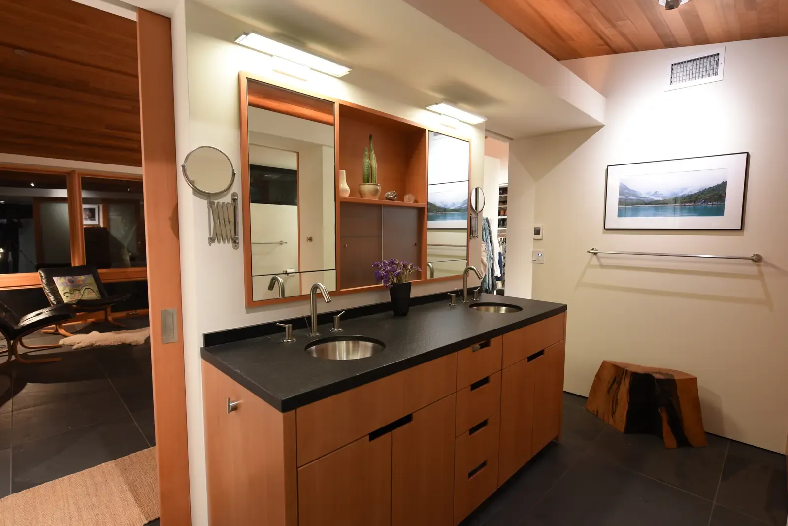Vanity run in rift-sawn cedar under a continuous mirror