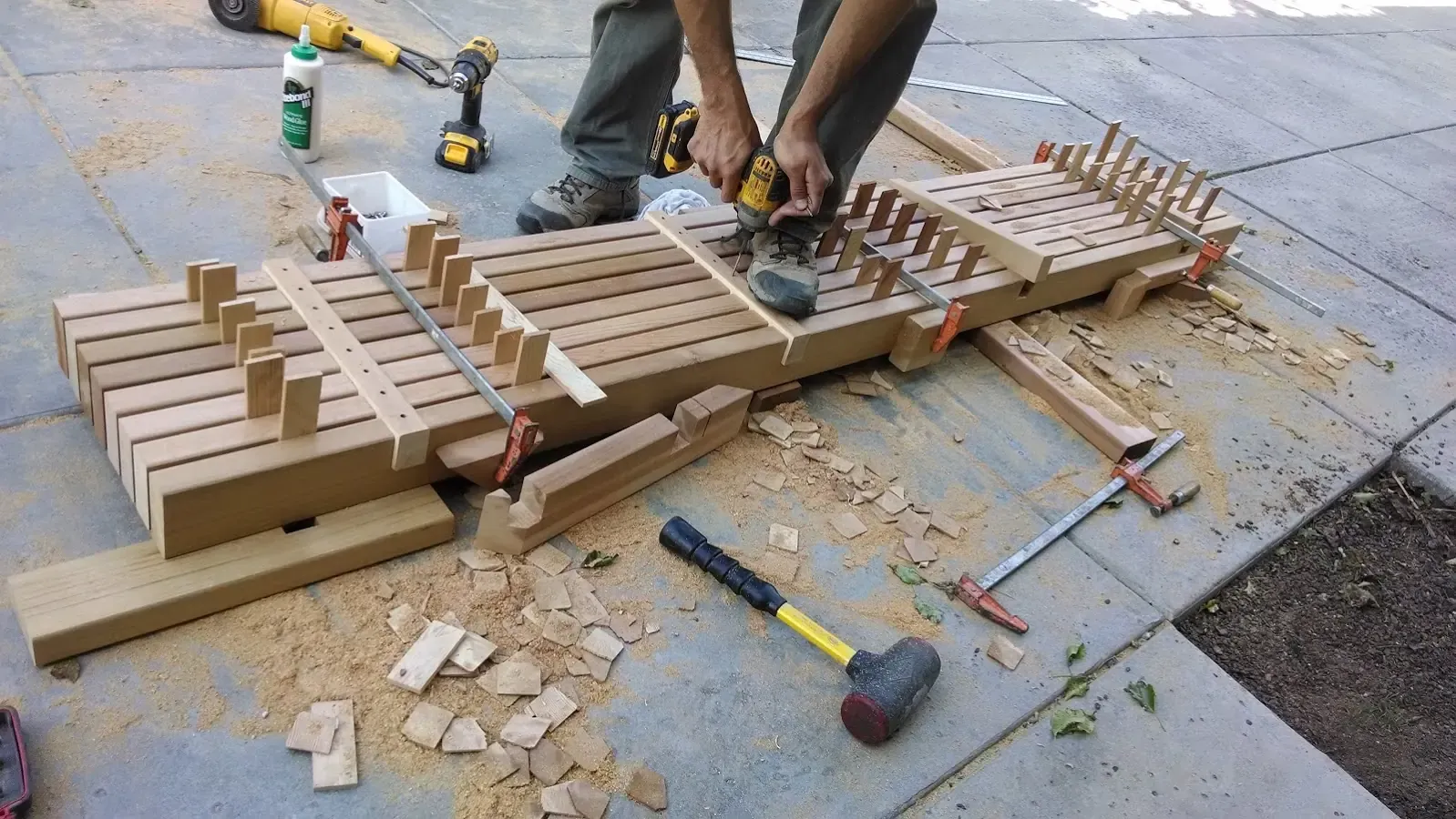 Building the bench — slats being fixed to the frame on site