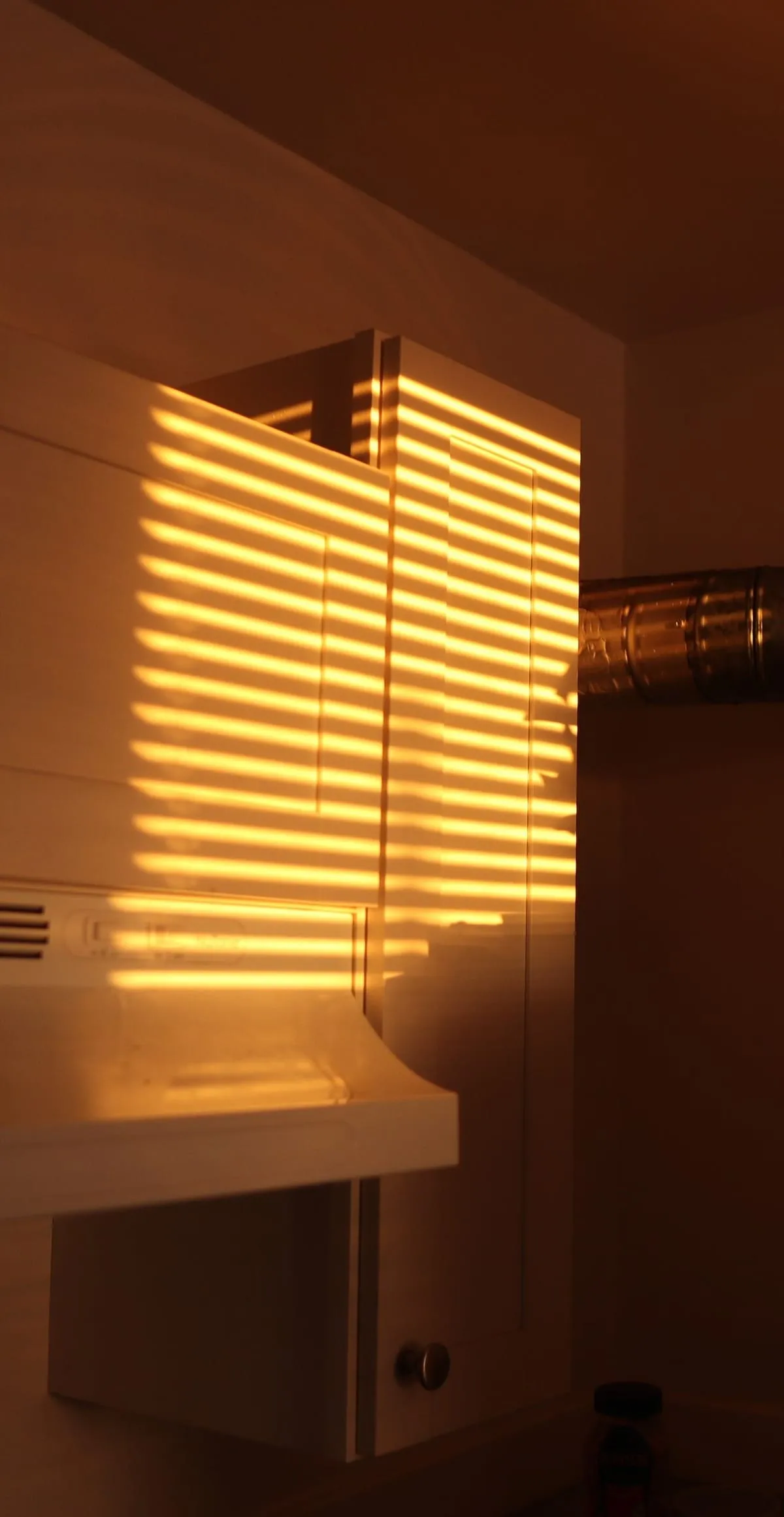 Late sun through window blinds